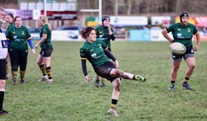 Rugby player kicking Rugby ball