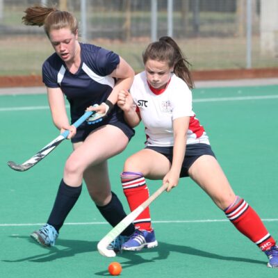 Two woman hockey players